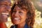 Loving Senior African American Couple Hiking Along Trail In Countryside Together