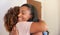 Loving Senior Mother Hugging Adult Daughter Indoors At Home