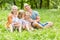 Loving siblings with parents in the garden