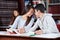 Loving Teenage Couple Holding Hands At Table In