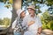 Loving wife wearing hat hugging her handsome caring man