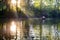 Loving young couple in boat at lake having romantic time.