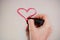 Lovingly Drawn: Young Female Hand with Red Lipstick Creating Heart Shape and \\\'Love\\\' on Retro Mirror