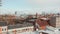 Low aerial view of house rooftops in residential neighborhood near radio telecommunication tower in Hamburg, Germany