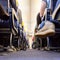 Low agle view of passenegers commercial airplane aisle with passenegers sitting on their seats while flying