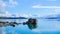 Low-angle of Aoraki(Mount) Cook mountain with lake view sunlit clear sky background