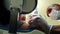 Low angle close up of dental assistant turning on lamp and examining patient