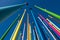 Low angle of colorful poles against blue sky
