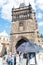 Low angle detail historic Charles Bridge gate and Tower, it`s G