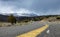 LOW ANGLE: Empty asphalt road leading towards the breathtaking snowy mountains.