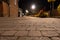 Low angle of an empty cobbled street on a summer`s night. UK