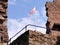 Low angle of a flag on the Nanstein Castle ruins in Landstuhl, Germany