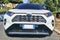 Low angle front view of aggressive and beautiful front design of white suv car model Toyota Rav4 Hybrid