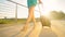 LOW ANGLE: Golden morning sun rays shine on tourist girl walking to the airport.