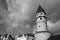 Low angle greyscale view of the Bockenheimer Warte watchtower in Cologne, German