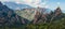 Low-angle of mountains of Corsica against cloudy sunlit sky France