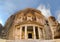 Low angle panoramic view of the facade of the Treasury building in the ancient Nabatean ruins