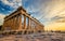 Low angle perspective of columns of the Parthenon at sunset