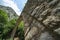 Low angle point of view of structure and arch of historic stone single arch pedestrian bridge at Zagori in mountains in central