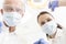 Low angle portrait of colleagues wearing masks at dental clinic