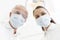 Low angle portrait of colleagues wearing masks at dental clinic