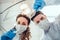 Low angle portrait of male and female dentists wearing masks at dental clinic