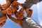 Low angle portrait of smiling multiracial elementary schoolboys making huddle while playing soccer