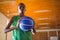 Low angle portrait teenager holding ball