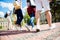 Low angle rear view shot of six student`s feet, they are walking