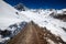 Low-angle of a road leading to the snowy ridged Kala Patthar, Sikkim, India, sunlit