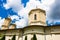 Low angle sho of an orthodox church near Bucharest, Romania under a cloudy sky