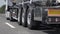 Low angle shot of the back of a driving gasoline tanker truck. Cargo transportation concept