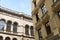 Low-angle shot of beautiful buildings with arched and rectangular windows