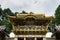 Low angle shot of the beautiful golden Yomeimon Gate at Toshogu Shrine in Nikko, Japan