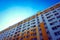 Low angle shot of a building, bright blue sky above