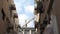 Low angle shot building crane works among houses under sky