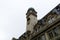 Low angle shot of a building fragment with part of tower in Paris France