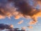 Low angle shot of a cloudy orange and blue sky at sunset