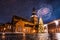 Low angle shot of the colorful fireworks on the church on a starry evening