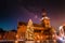 Low angle shot of the colorful flights on the church on a starry evening