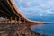 Low angle shot of a curvy bridge in a bay area over sea and part of the shore