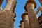 Low-angle shot of the detail of the columns with closed papyriform capitals in  Karnak, Egypt