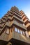 Low angle shot of the facade of the residential building under a blue sky