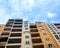 Low angle shot of the facade of a yellow suburban residential building