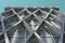 Low angle shot of the geometrical facade of a cement building under the blue sky