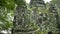 Low angle shot of a lichen covered face-tower in angkor