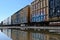 Low angle shot of a locomotive train with graffiti art reflection on the rainwater