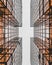 Low angle shot of modern geometrical glass buildings making cross view, Honk Kong