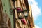 Low angle shot of old street lamps attached to the walls of the buildings