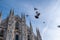 Low angle shot of the pigeons flying above the magnificent Milan Cathedral in Milan, Italy